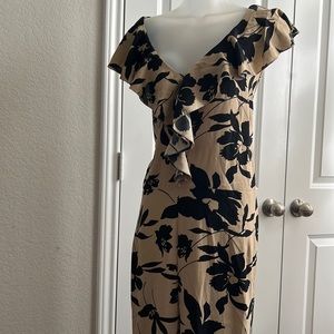 A Black and Tan romper silk beautiful neckline great for cruising